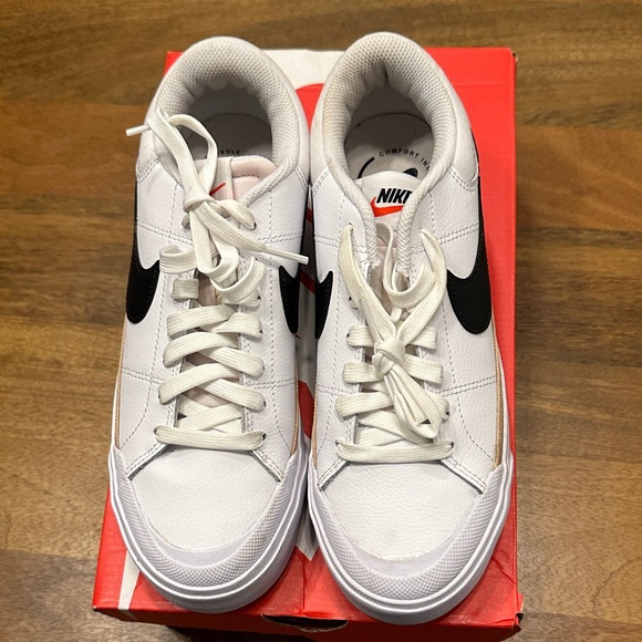 Nike Shoes - Nike White Leather Sneakers with Black Swoosh